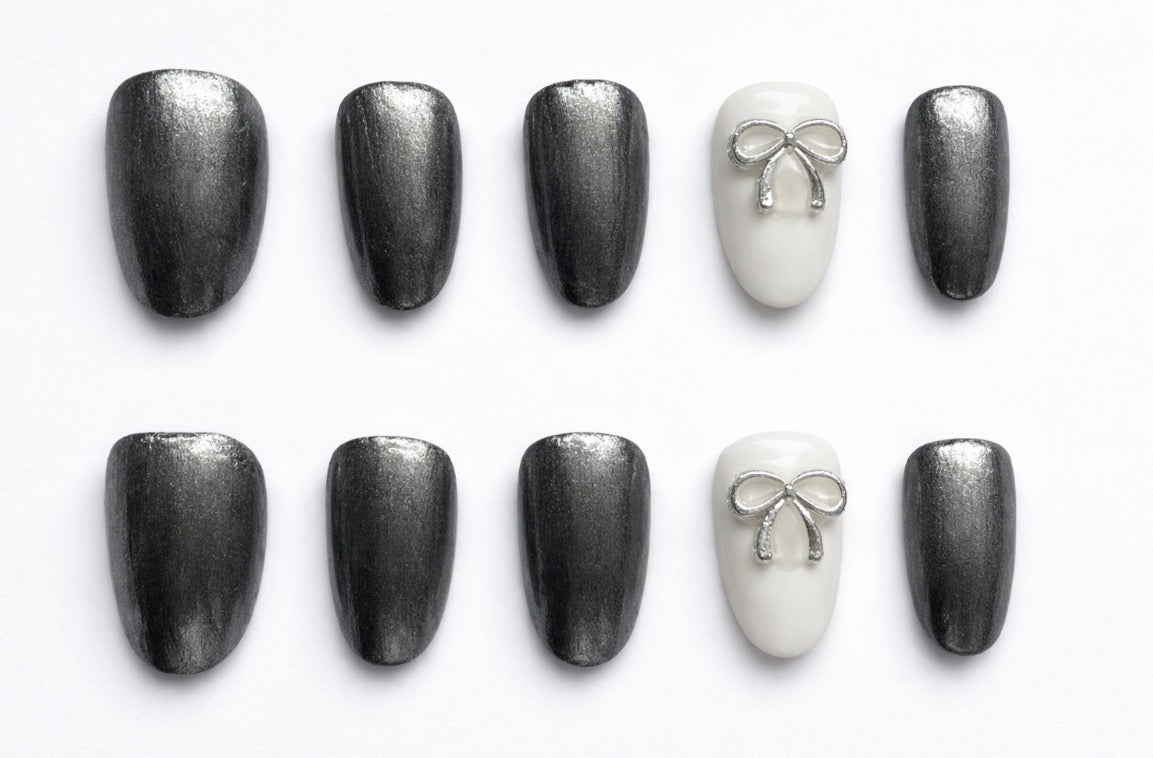 Glossy Silver and white Handcrafted Press-On Nails with silver bow decoration